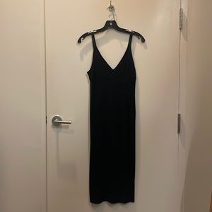 Black bodycon dress. Hits just below the knees. Adjustable straps. Worn twice.